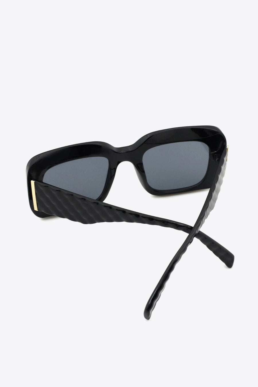 Black rectangular sunglasses with textured arms and gold detail