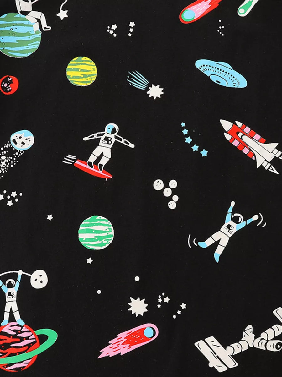 Black cotton toddler t-shirt with a whimsical space adventure print featuring astronauts, planets, rockets, and UFOs.