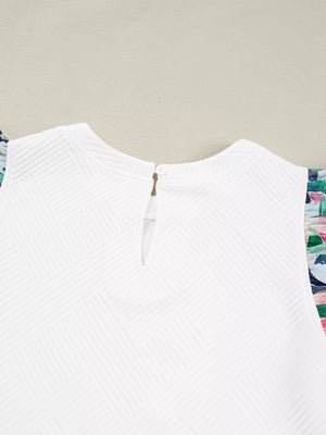 White geometric knit top with floral ruffled sleeves and button back closure.