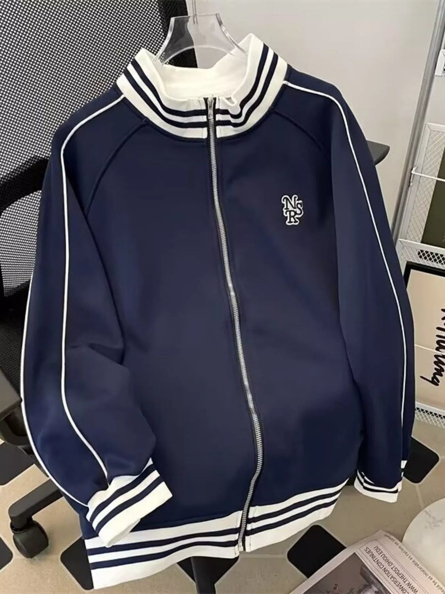 Navy blue zip-up sweatshirt with white piping and striped collar and cuffs.