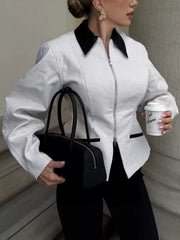 100% Cotton Care instructions: Machine wash cold zip-up jacket in black with fitted silhouette