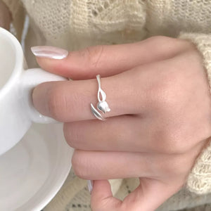 ring in silver with floral and bypass design