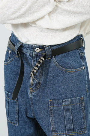 Medium wash denim wide leg cargo pants with buckle pocket detail.