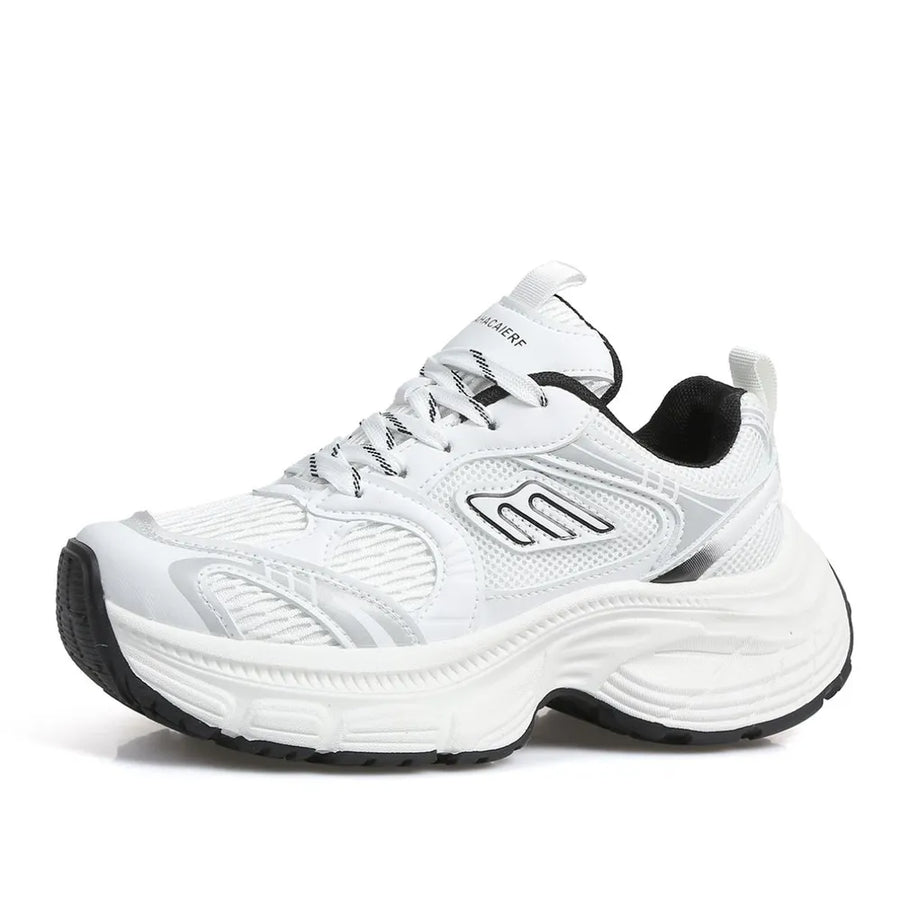 White chunky retro runner sneakers with black and silver accents and a thick sole.