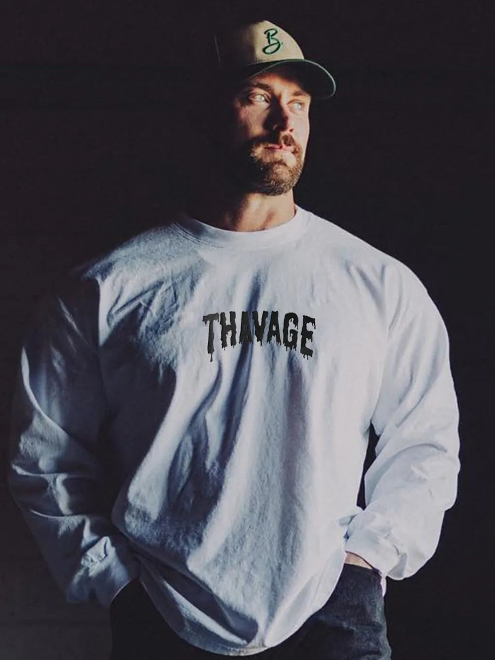 White long sleeve t-shirt with black dripped logo detail on chest