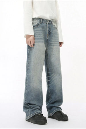 Oversized baggy wash denim trousers in medium blue with a relaxed fit and wide leg.