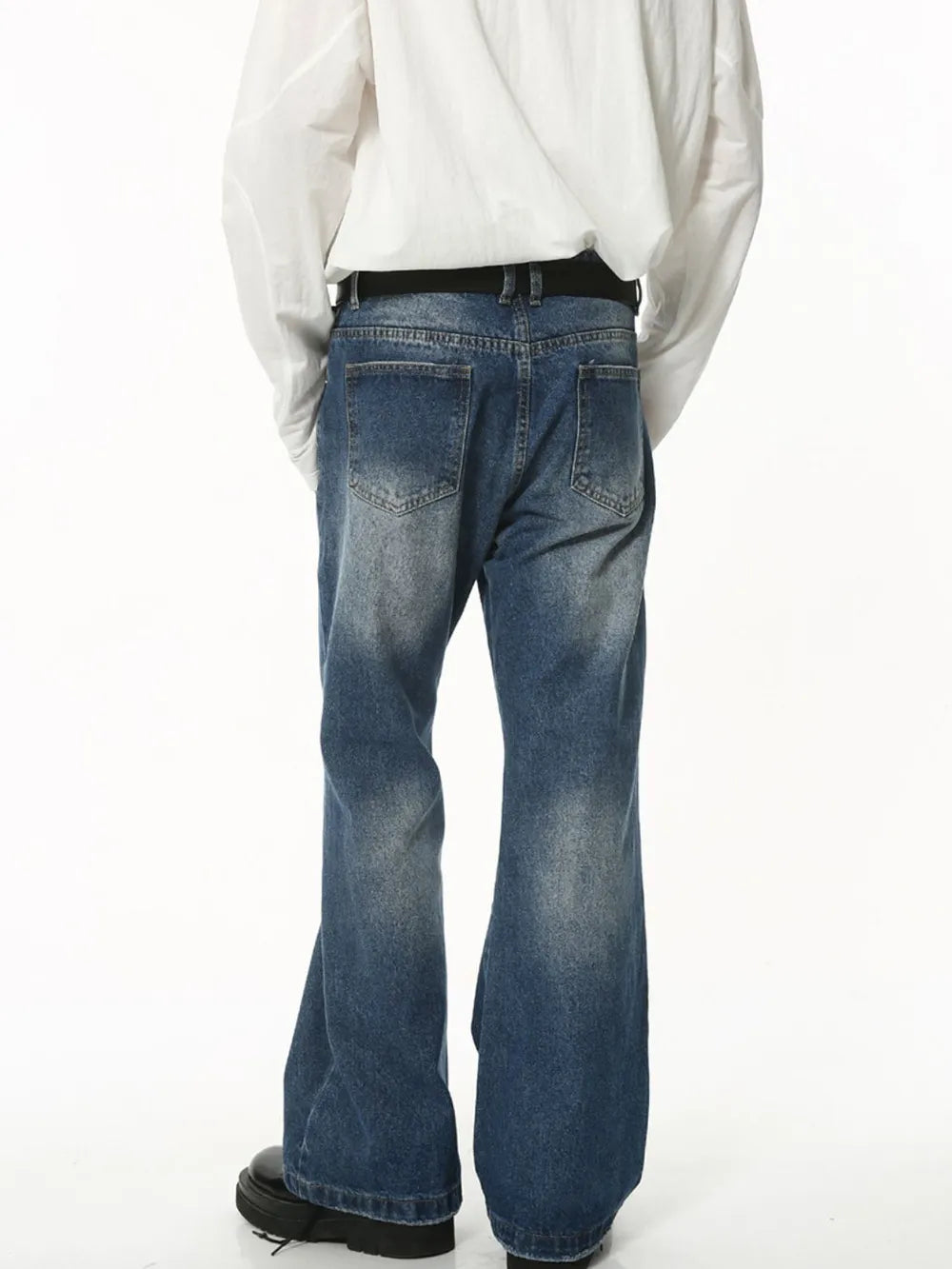 Faded flare jeans in dark wash denim with sculpted seam detail.