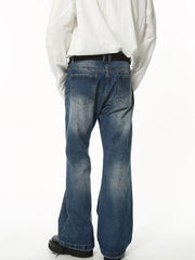 Faded flare jeans in dark wash denim with sculpted seam detail.