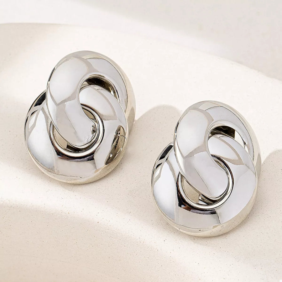 Chunky knot silver-plated earrings with a polished finish.