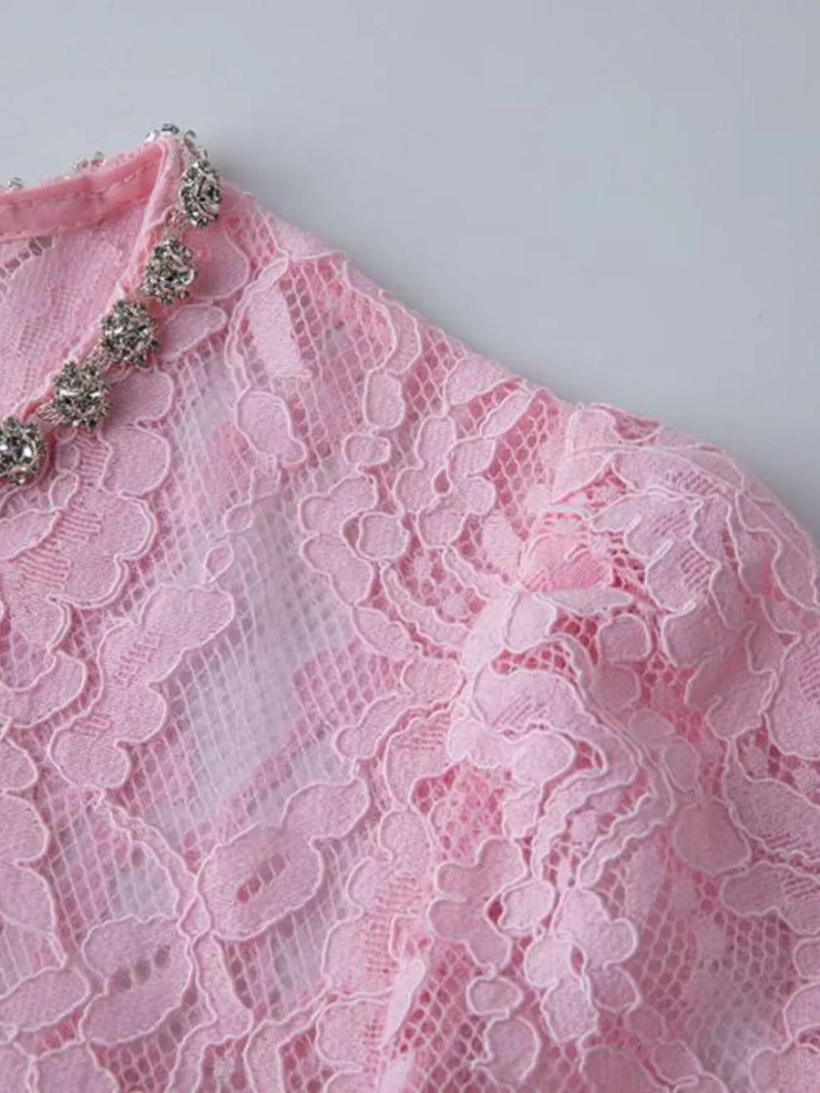 Pink lace midi dress with sheer sleeves and jeweled neckline detail