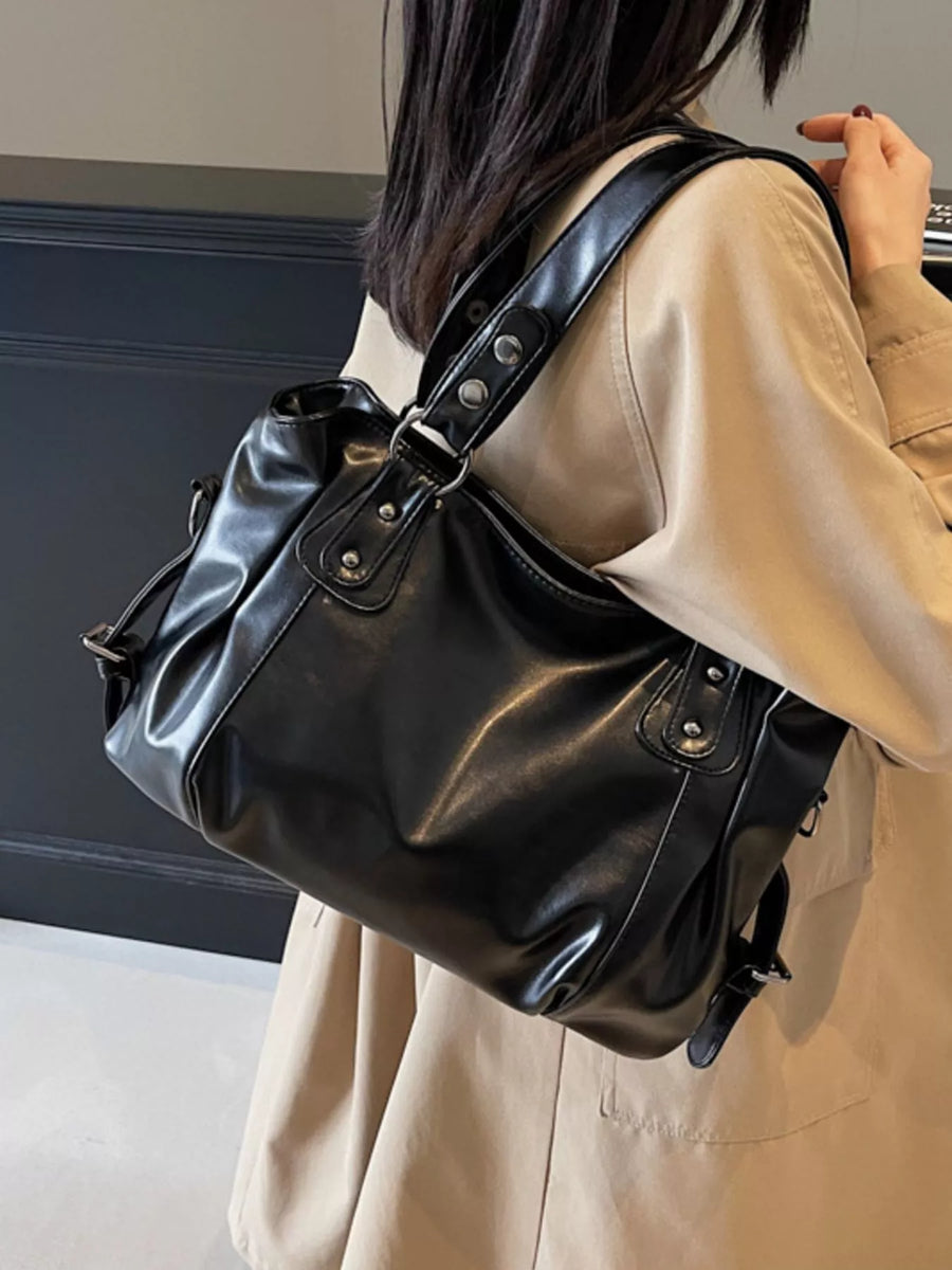 Large black vintage PU leather shoulder bag with silver hardware details.
