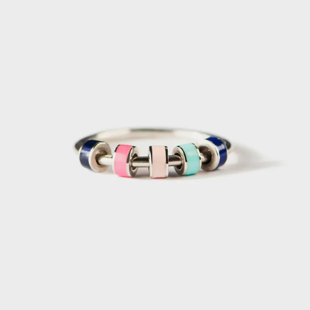 Sterling ring with colorful enamel beads in pink, light pink, teal, and navy.
