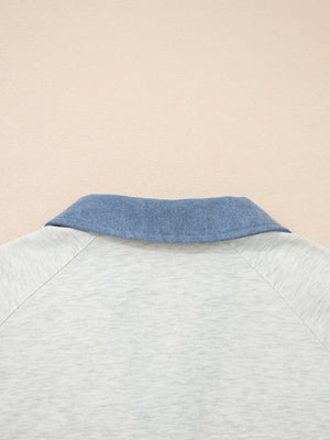 Heathered casual top with blue denim collar and raglan sleeves.