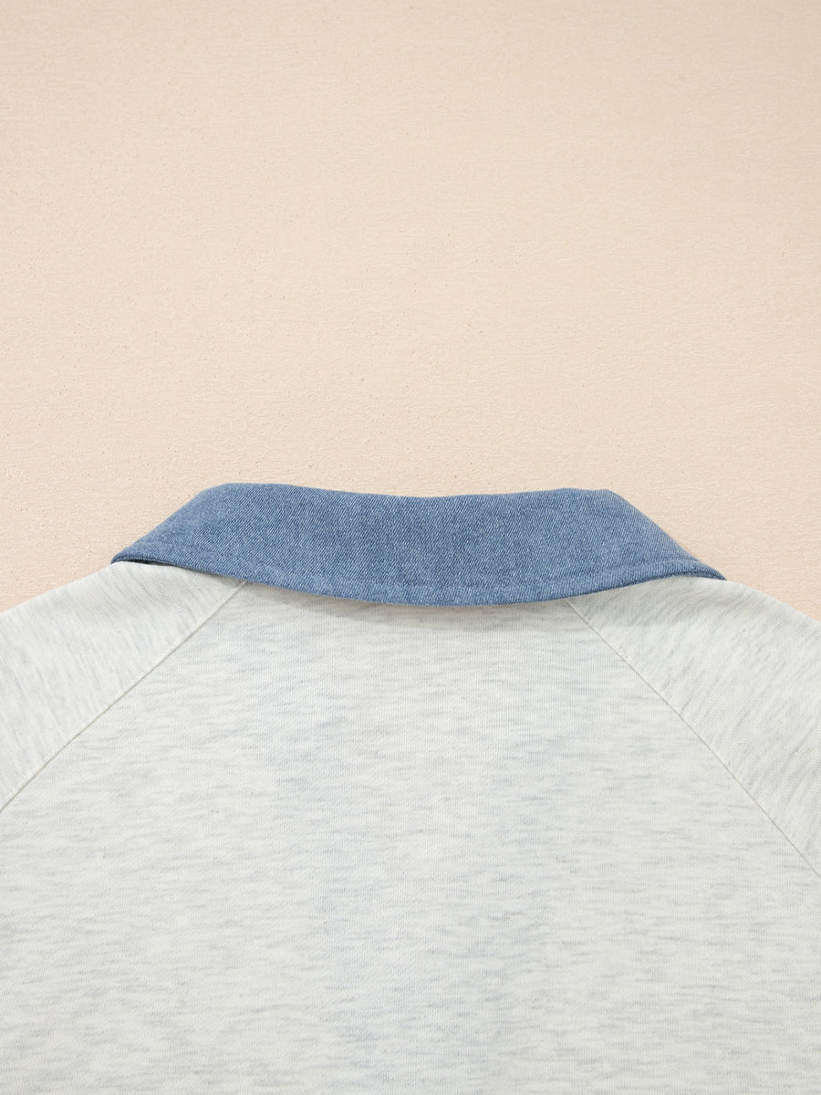 Heathered casual top with blue denim collar and raglan sleeves.