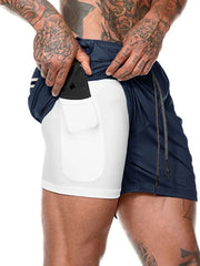 Navy dual-layer performance shorts with white compression liner and phone pocket