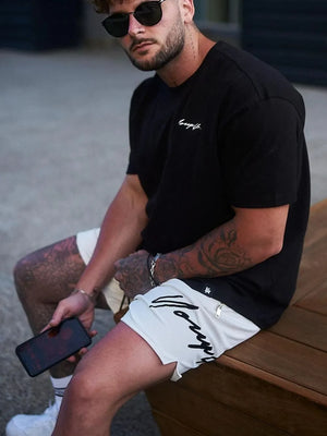 BigFit drawstring shorts in beige with black script logo and zipper detail.