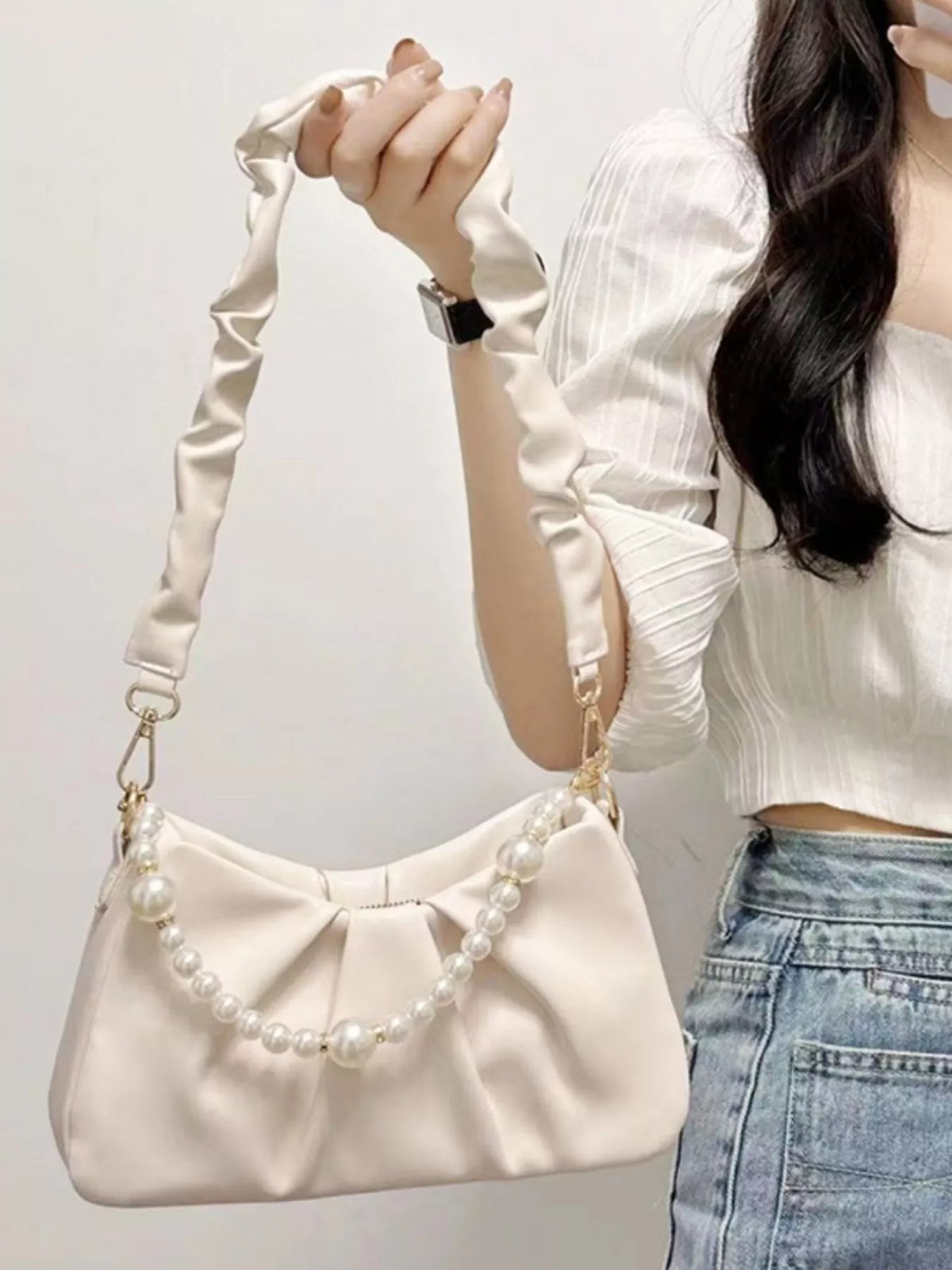 Beige ruched shoulder bag with pearl strap detail