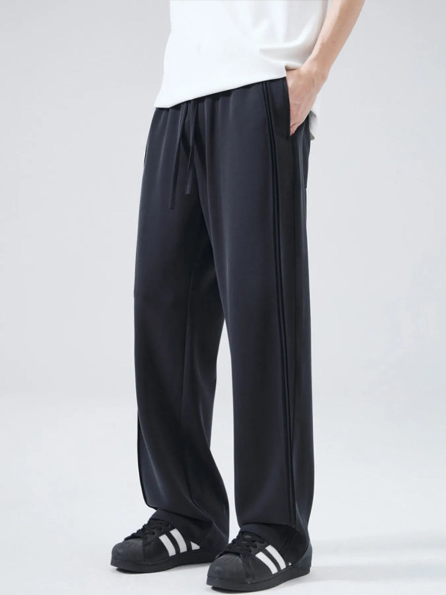 Black relaxed fit drawstring casual pants with double stripe detail.