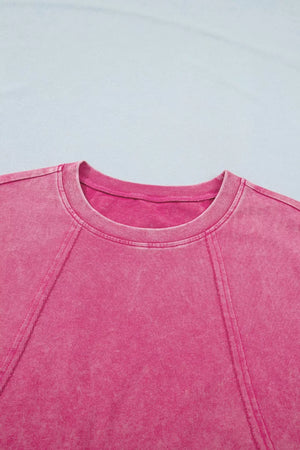 Pink mineral wash t-shirt with cap sleeves and contrast stitching detail.