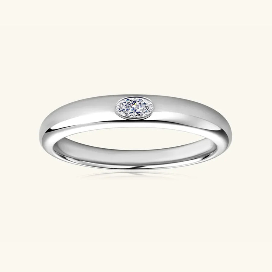 Silver oval drill band ring with moissanite accent