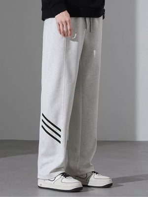 Light Flower Gray sweatpants with black stripes on the left leg, loose fit.