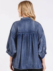 65% cotton, 35% polyester Care instructions: Machine wash cold button-up shirt in denim blue with loose silhouette