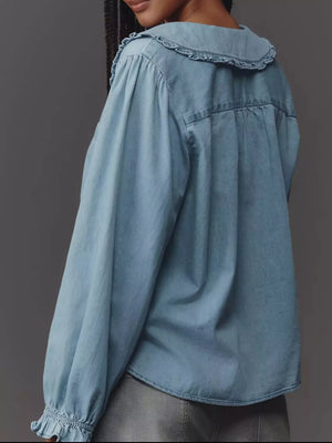 Blue denim shirt with ruffled Peter Pan collar and puff sleeves.