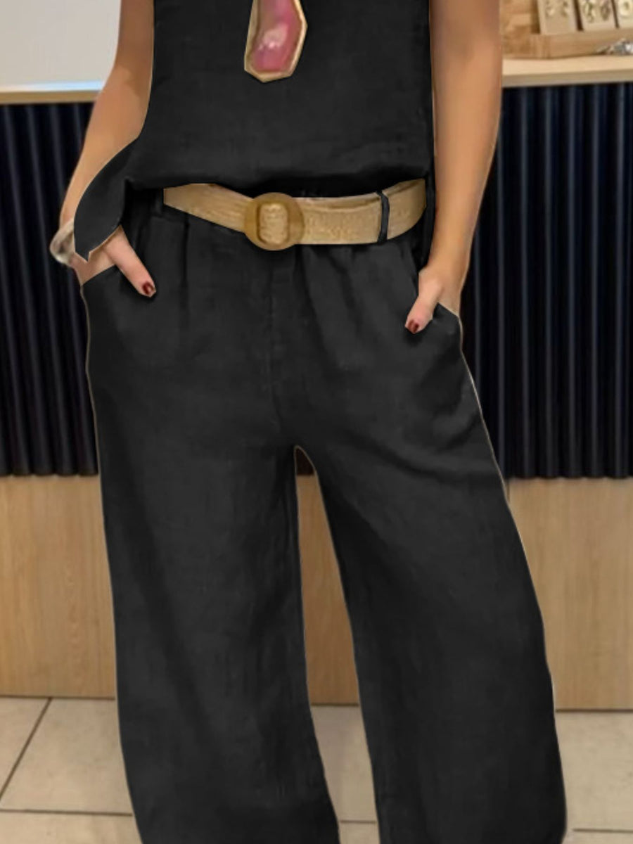 Black relaxed fit tank and wide-leg pants set with a tan belt.