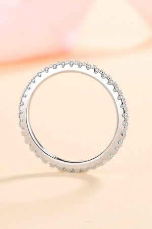 Sterling silver eternity band ring with micro-pave set cubic zirconia stones.