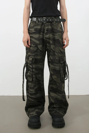 Wide-leg camo cargo pants in green camouflage with a black belted detail and multiple cargo pockets.