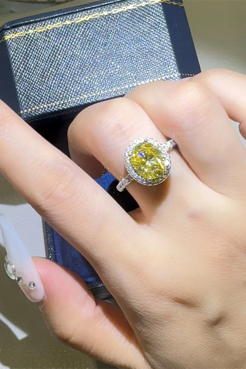 Yellow diamond halo ring in 925 silver with a bright canary diamond centerpiece.