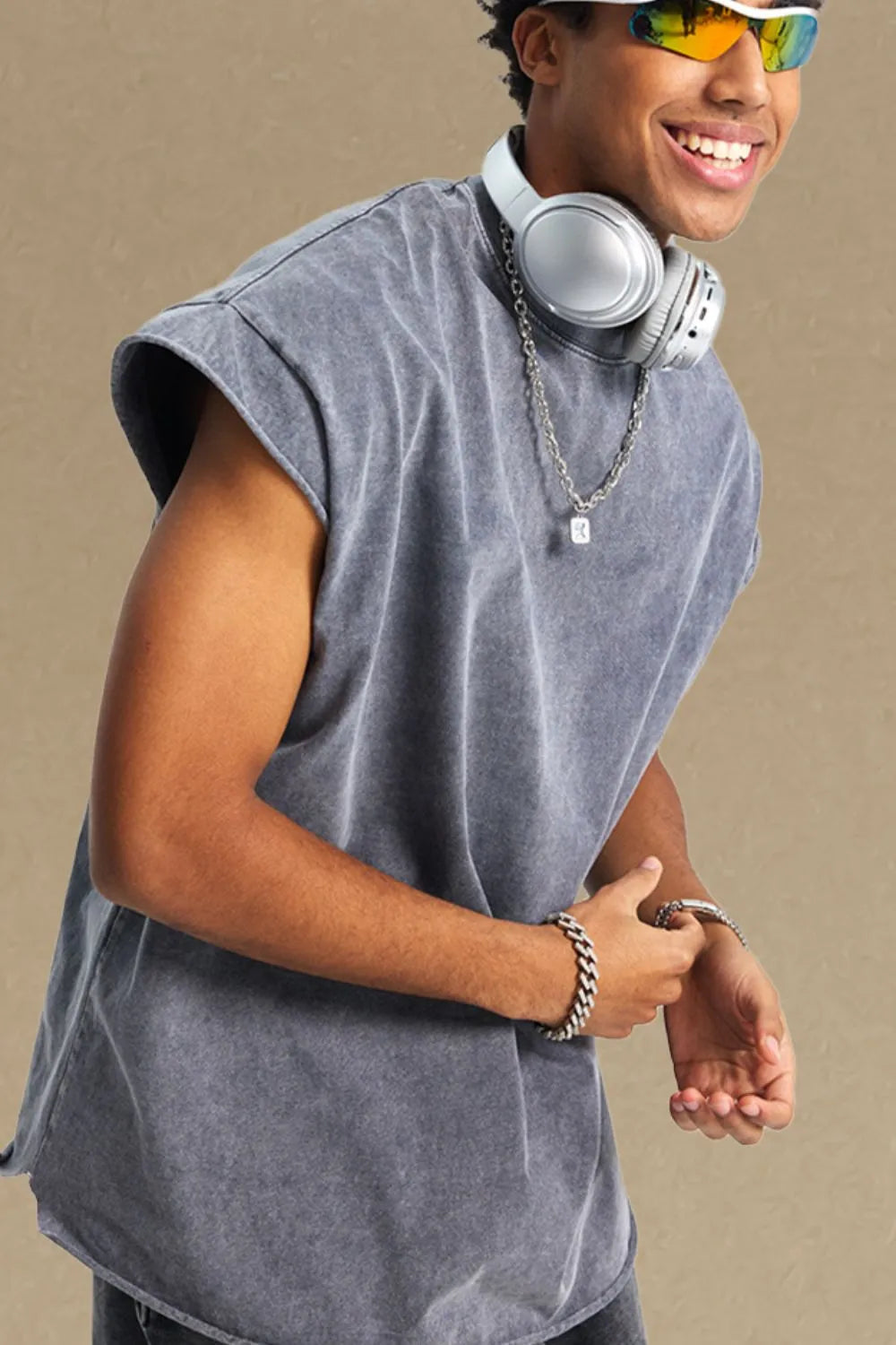 Acid wash gray boxy muscle tee with a relaxed fit and raw hem sleeves.