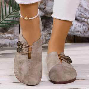 Chic round-toe casual flats in light brown with decorative buttons and elastic laces.