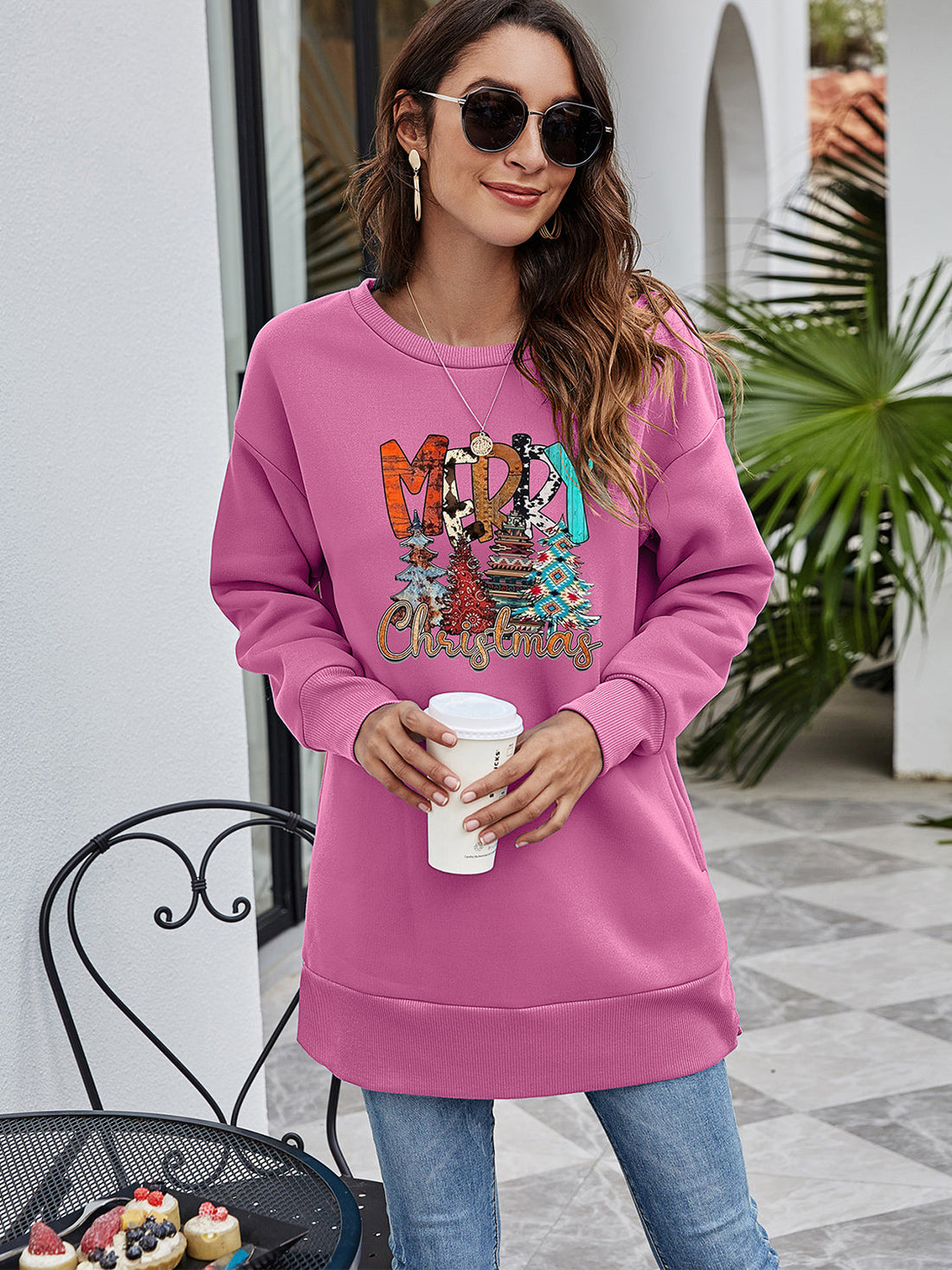 Extended hemline dusty purple sweatshirt with festive Merry Christmas graphic and trees.