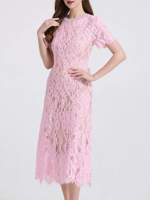 Pink lace midi dress with pearl neckline and short sleeves.