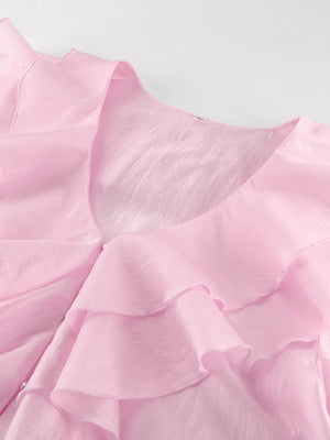 Pink ruffle trim long sleeve blouse with V-neckline and sheer fabric.