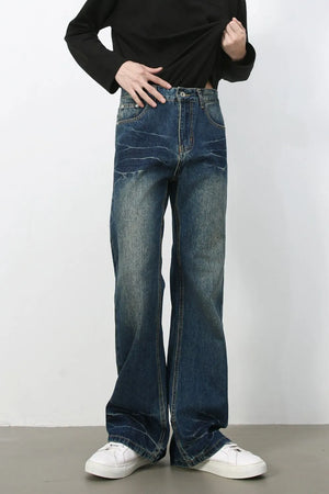 Faded wash flare jeans in dark denim with a casual bootcut style.