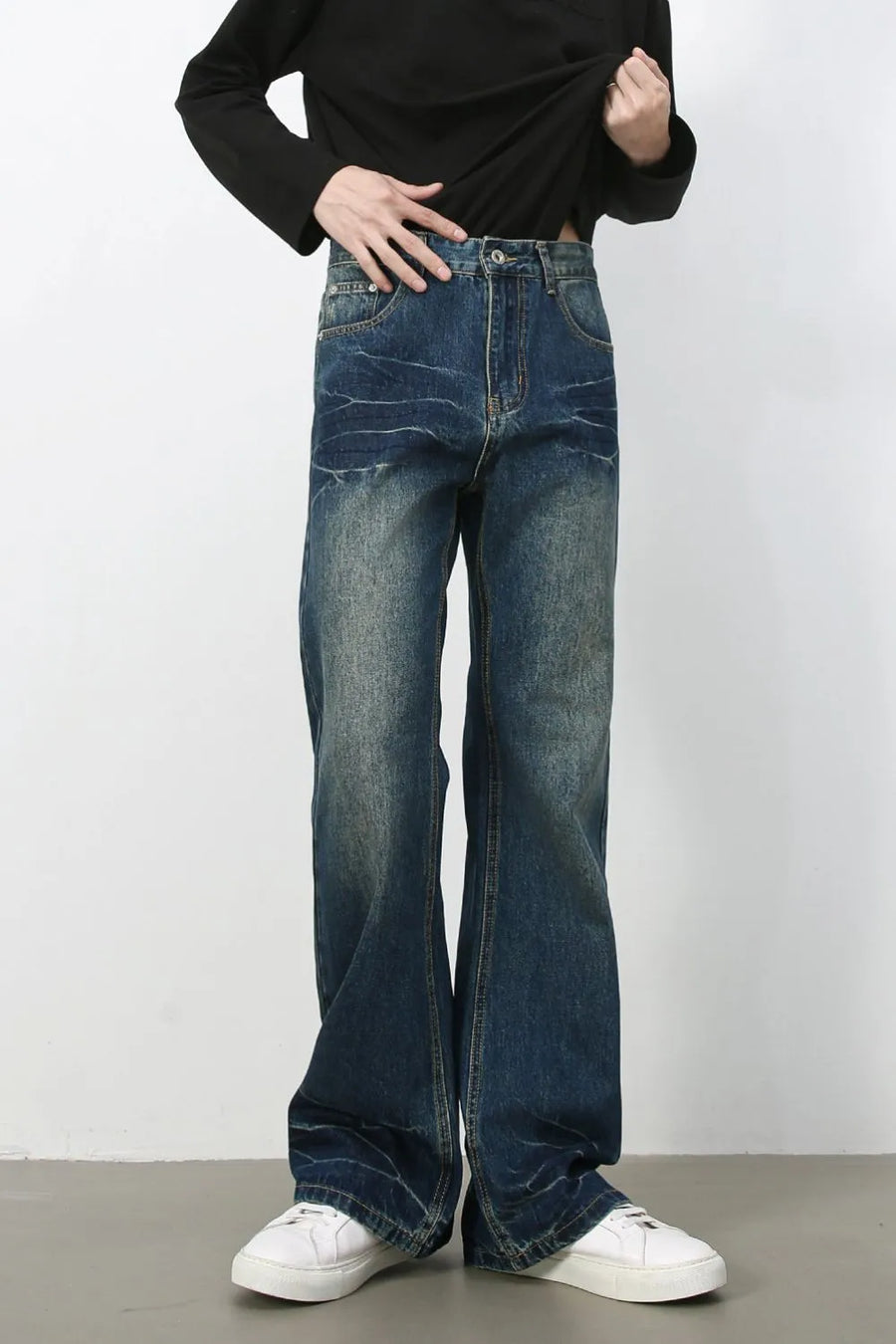 Faded wash flare jeans in dark denim with a casual bootcut style.