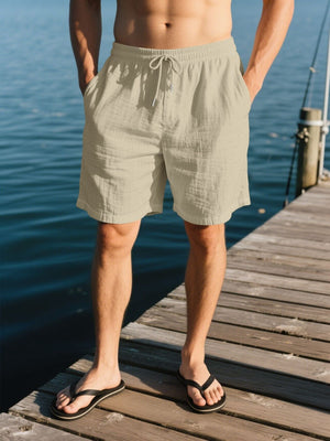Men's beige linen drawstring shorts with pockets