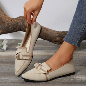 Knit bow loafers in ivory with contrast trim and pointed toe.