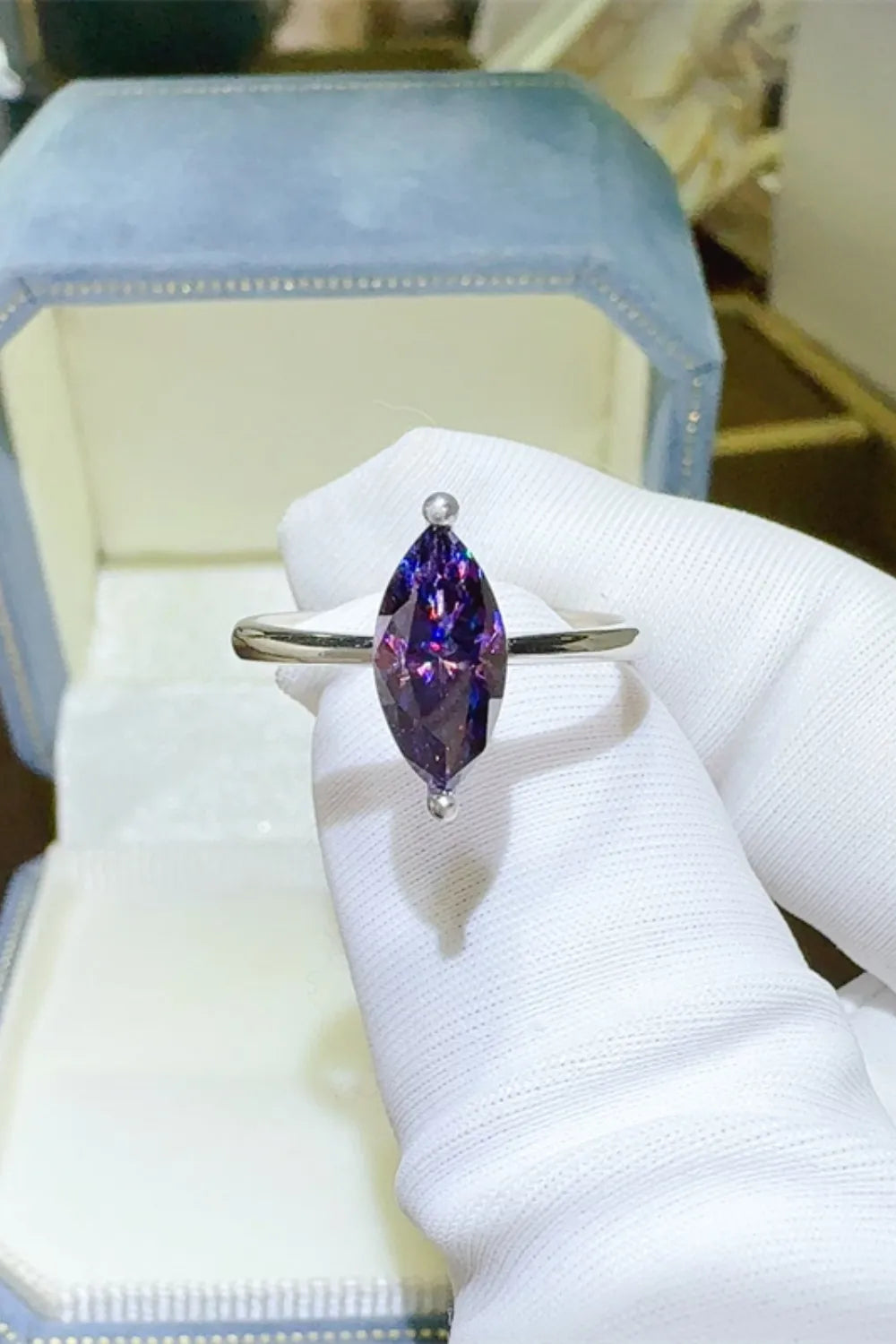 Marquise cut amethyst sterling silver ring with a violet gemstone.