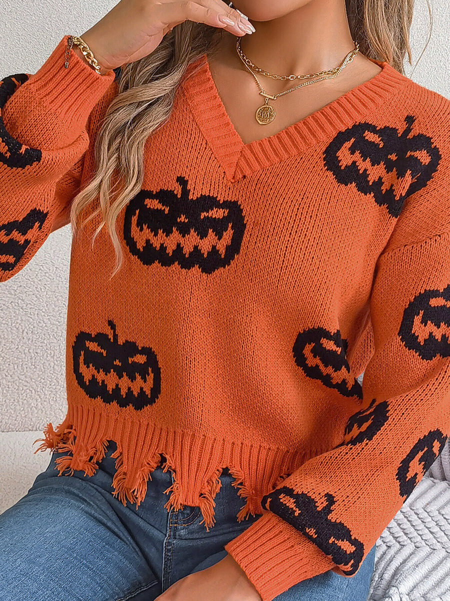 pullover sweater in Black with pumpkin and raw hem