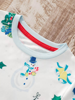 White children's pajama top with festive snowman, Christmas tree, and bell print.