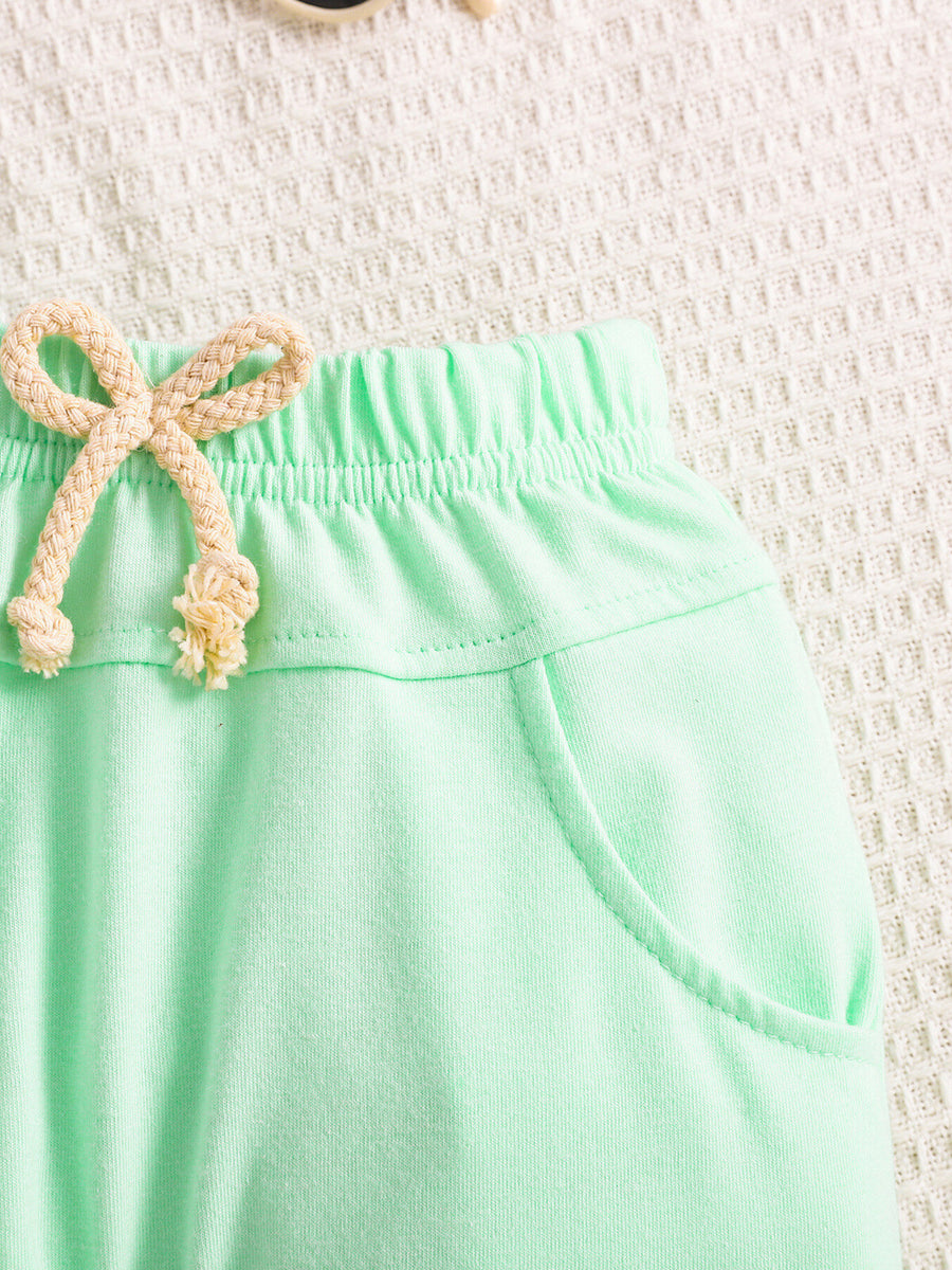 Light green cotton baby shorts with drawstring and pockets