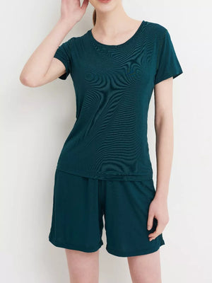 Fini Green short sleeve pajama set with crew neck top and elastic waist shorts.