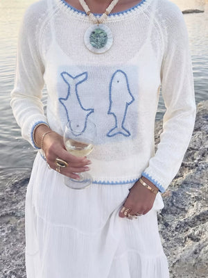 White pullover sweater featuring contrast trim and graphic
