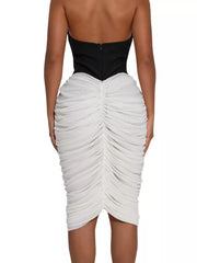 100% polyester Care instructions: Machine wash cold midi dress in Black with bodycon silhouette