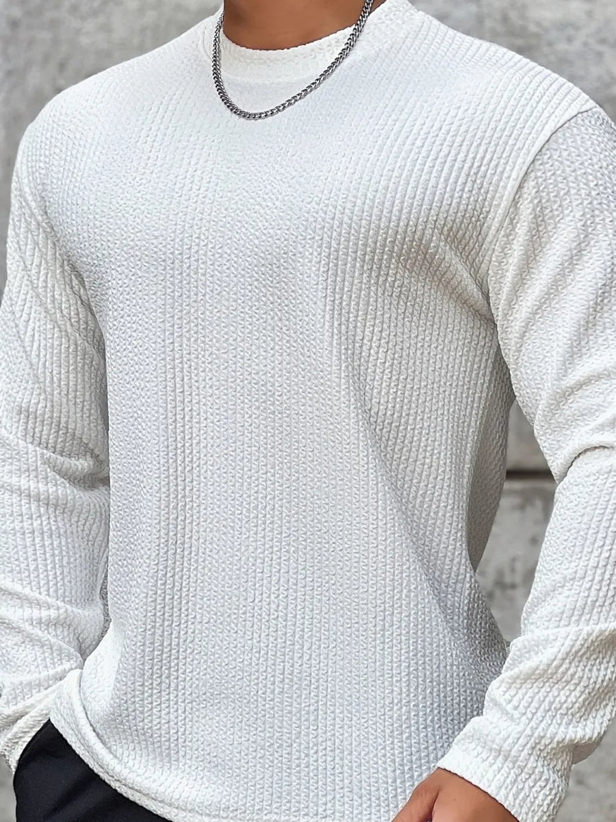 Men's white long sleeve t-shirt with textured fabric and round neck.
