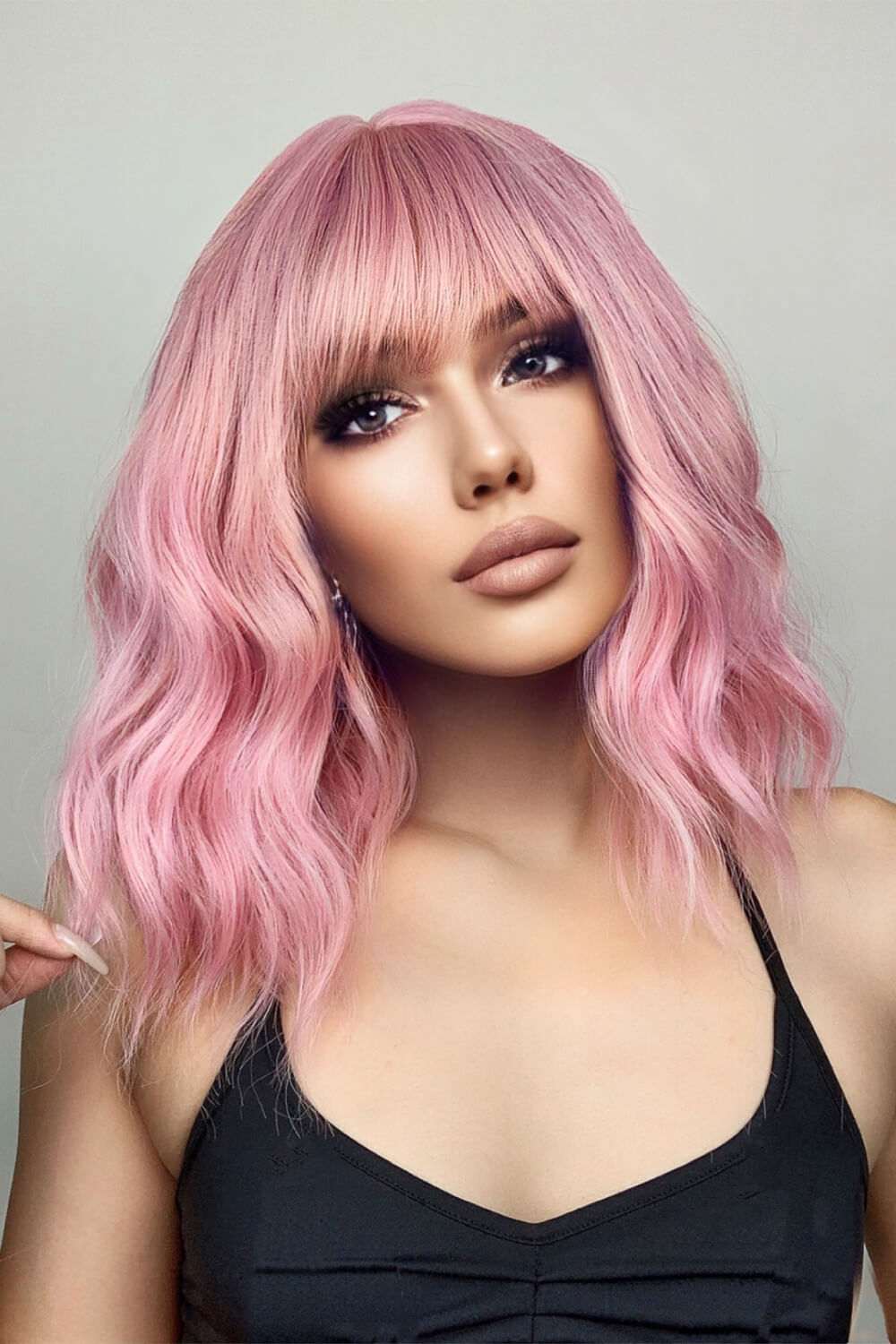 Pink bob wig with bangs and wavy texture