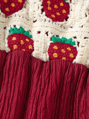 Crochet ruffle trim baby jumpsuit in cream with strawberry pattern and burgundy crinkle fabric bottom.